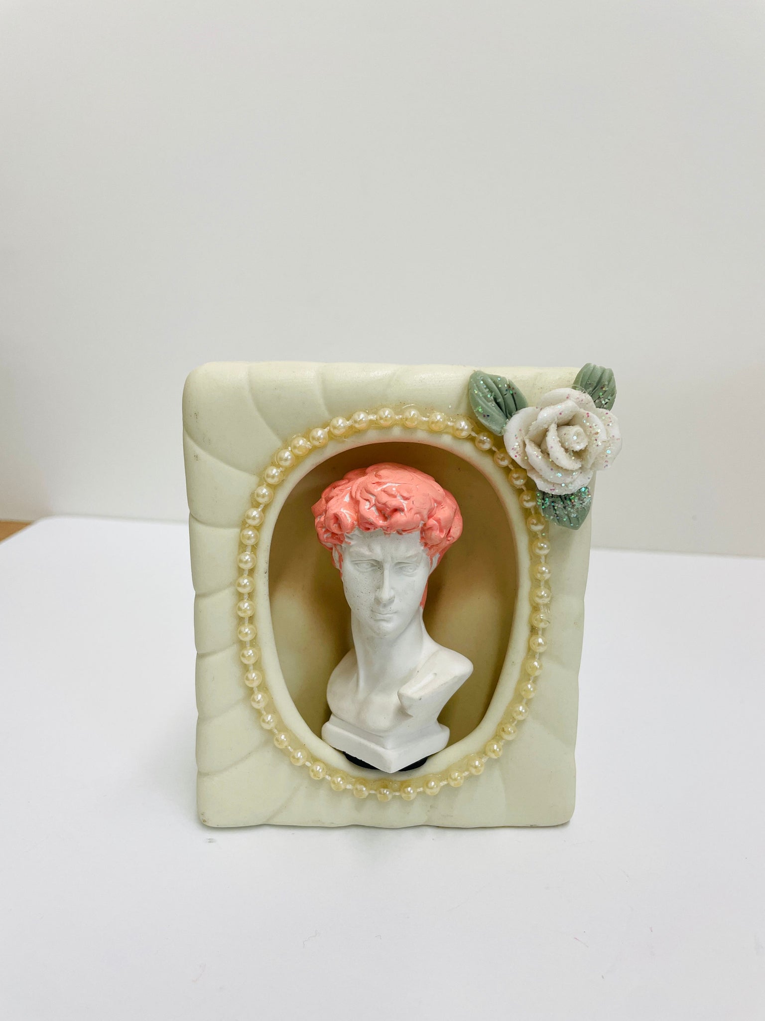 Luciana Pinchiero, "Framed Bust with Pink Hair from Shelves of Desire"